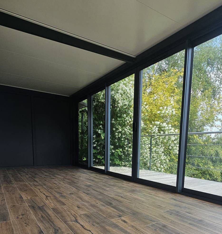 Véranda aluminium toit plein en Isère